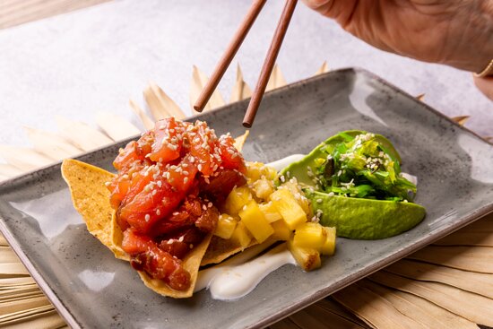Tulu Seaside Bar and Grill signature dishes Tuna Poke Bowl, Baja Fish Tacos, Tulu Burger, Acai Bowls
